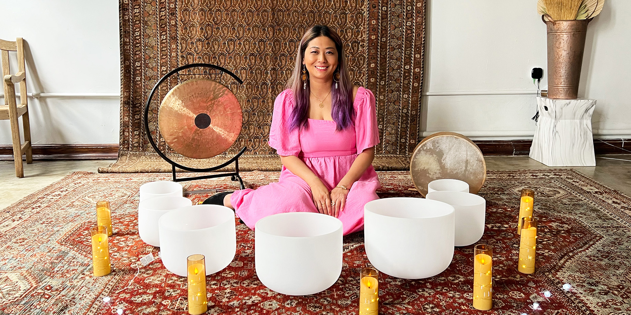 Grace Duong with singing bowls at a full moon sound bath