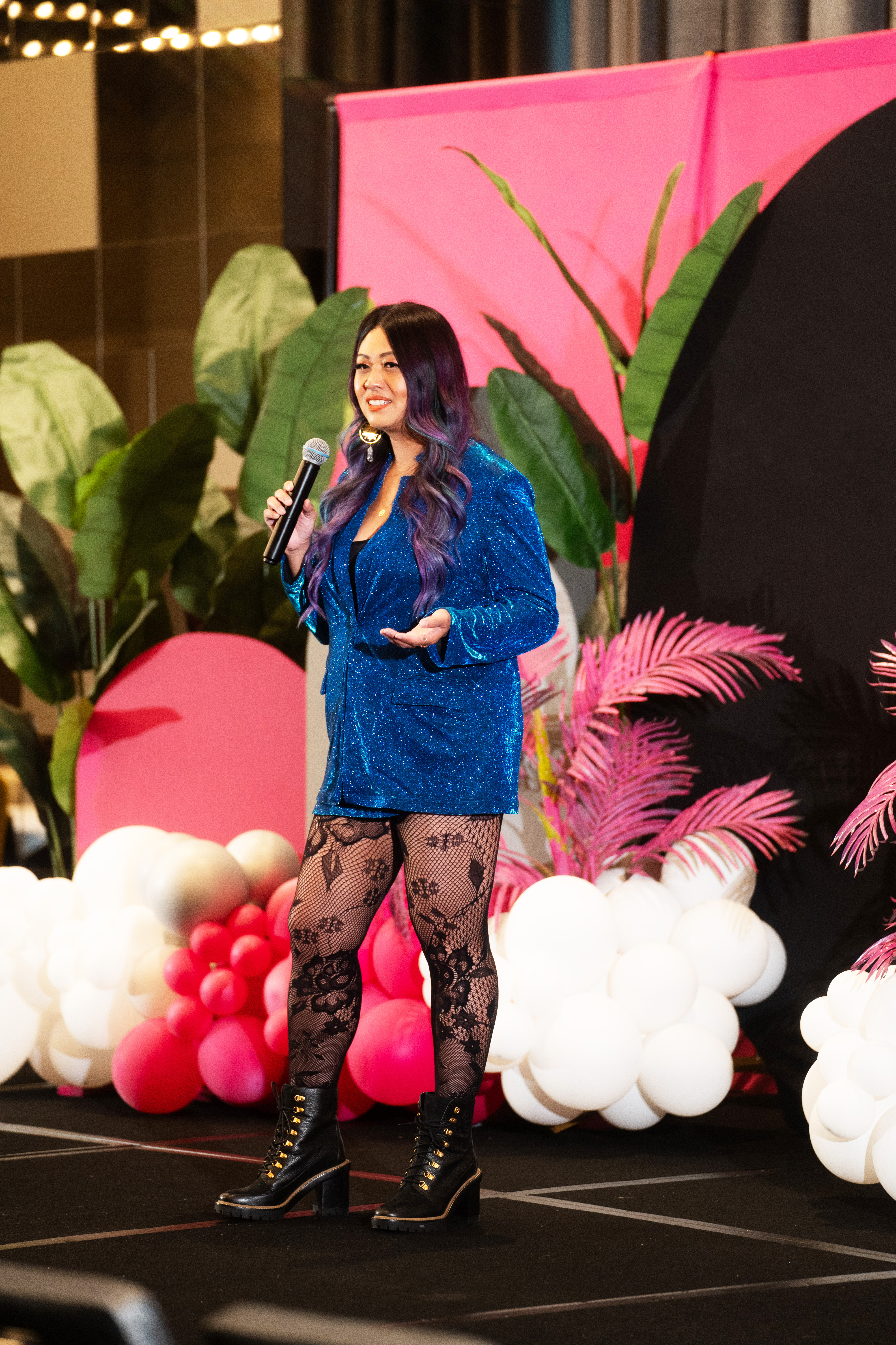 Grace Duong speaking on stage at a Philadelphia event